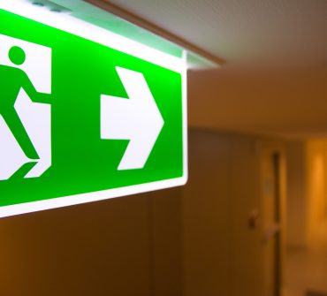 Emergency,Fire,Exit,Sign,At,The,Corridor,In,Building